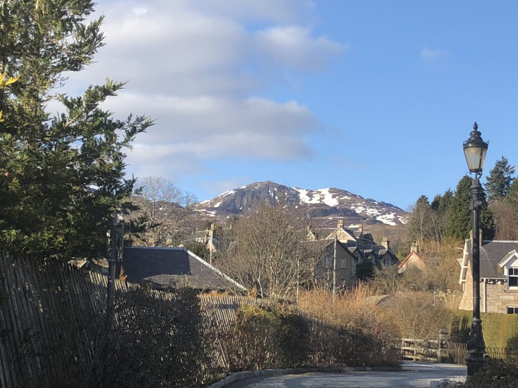 View of Pitlochry and a snow-capped Ben y Vrackie